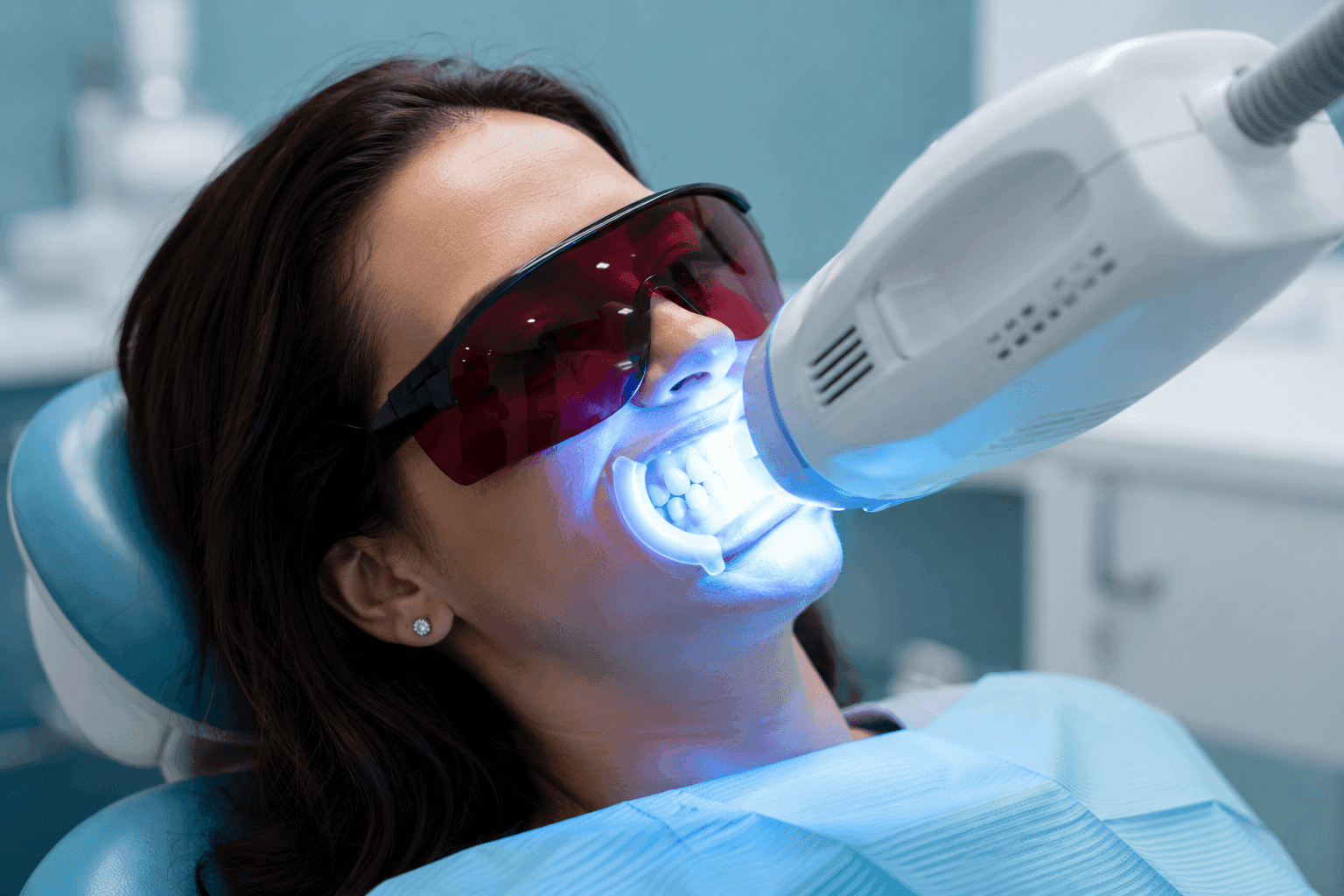 Teeth whitening light being applied during a one-hour session
